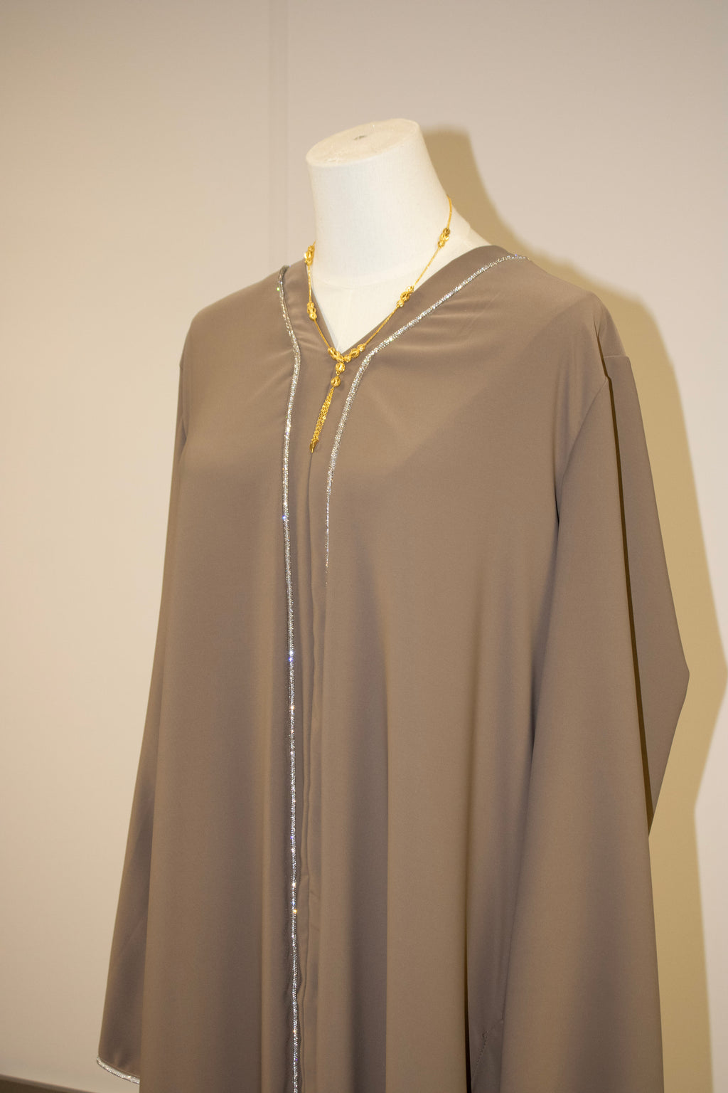 dark baige abaya lines