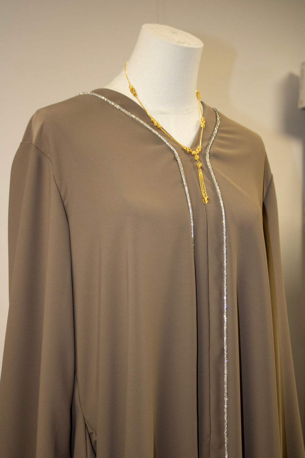 dark baige abaya lines