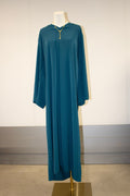 Blue dress on a mannequin against a plain background